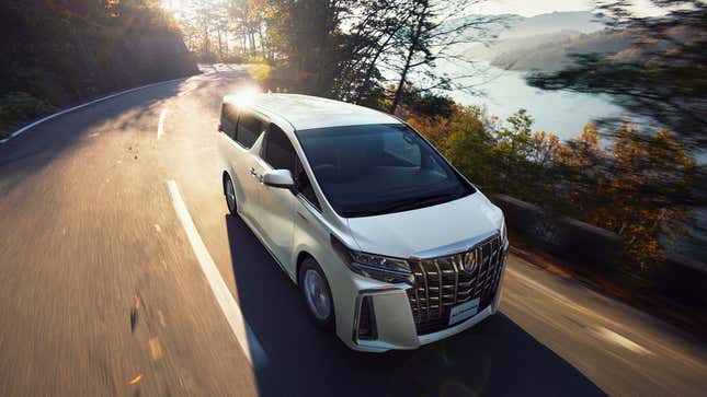 Image of a Toyota Alphard in white on a cliffside road