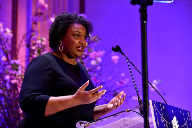 NEW YORK, NEW YORK - MARCH 16: Elevating Equity Honoree Stacey Abrams speaks on stage as Phoebe Robinson emcees Reading Partners' Dream Dinner Party honoring Stacey Abrams & Questlove, with special guest, Savannah Guthrie, co-hosted by Dawn Davis and Tara Westover at The Plaza on March 16, 2023 in New York City.