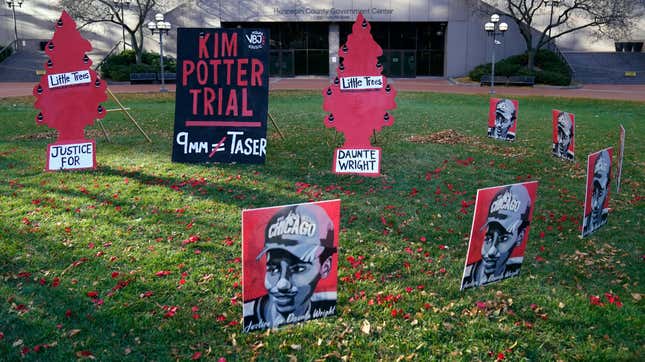 Posters stand on the south lawn Tuesday, Nov. 30, 2021, at the Hennepin County Government Center in Minneapolis where jury selection begins for former suburban Minneapolis police officer Kim Potter, who says she meant to grab her Taser instead of her handgun when she shot and killed motorist Daunte Wright. 