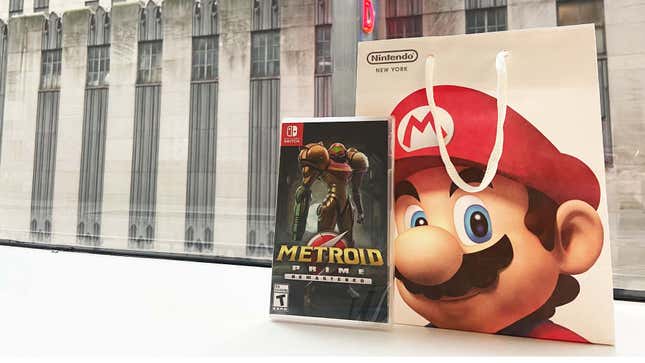 A photo shows a copy of Metroid Prime Remastered next to a bag with Mario's face on it. 
