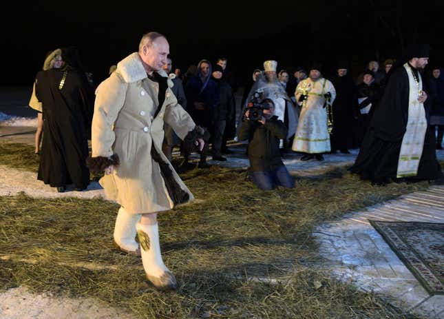 Russian President Vladimir Putin walks to take a dip in the water during Orthodox Epiphany celebrations at Lake Seliger.