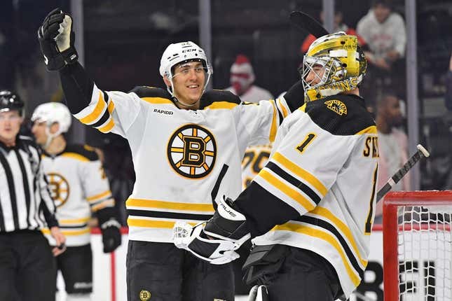 Apr 9, 2023; Philadelphia, Pennsylvania, USA; Boston Bruins goaltender Jeremy Swayman (1) and left wing Tomas Nosek (92) celebrate win against the Philadelphia Flyers breaking the NHL single-season wins record at Wells Fargo Center.
