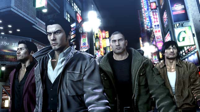 Characters in Yakuza 5 walk the streets of a Japanese city.