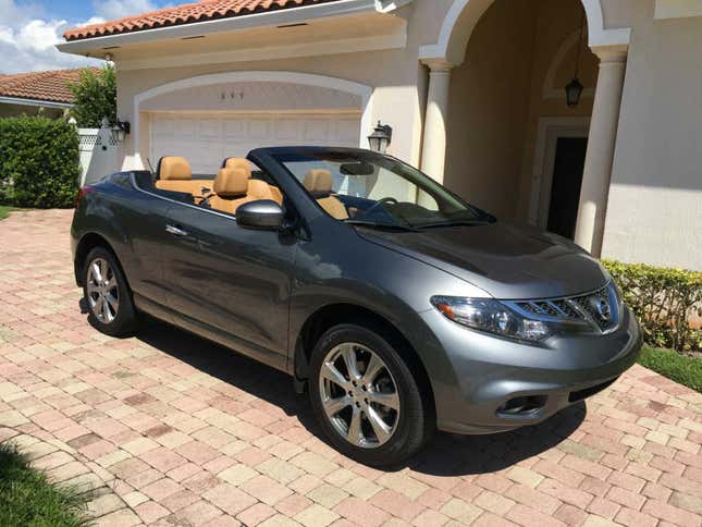 A Nissan Murano CrossCabriolet parked in front of a house