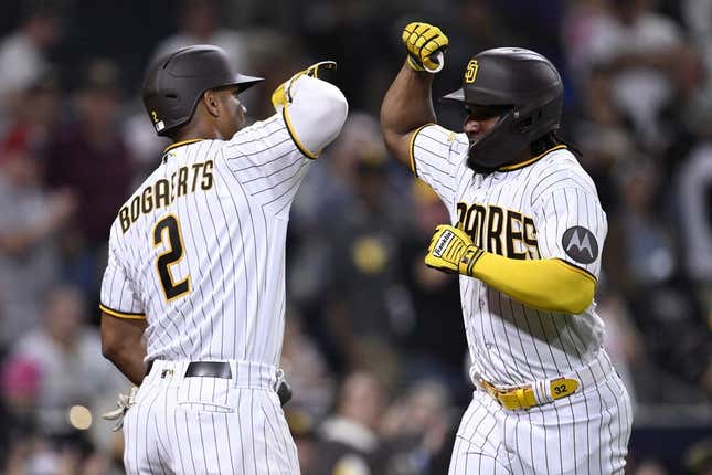 Sep 18, 2023; San Diego, California, USA; San Diego Padres third baseman Eguy Rosario (right) is congratulated by shortstop Xander Bogaerts (2) after hitting a home run against the Colorado Rockies during the third inning at Petco Park.