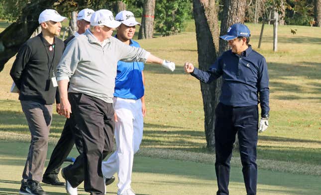 Abe and Trump fist bump.