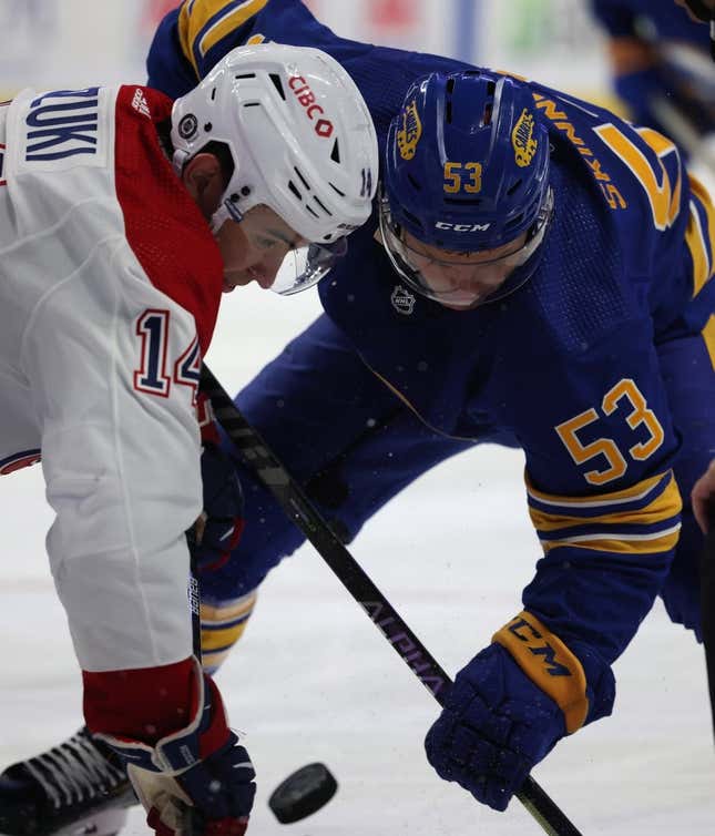 Oct 14, 2021; Buffalo, New York, USA;  Montreal Canadiens center Nick Suzuki (14) and Buffalo Sabres left wing Jeff Skinner (53) take a face-off during the second period at KeyBank Center.