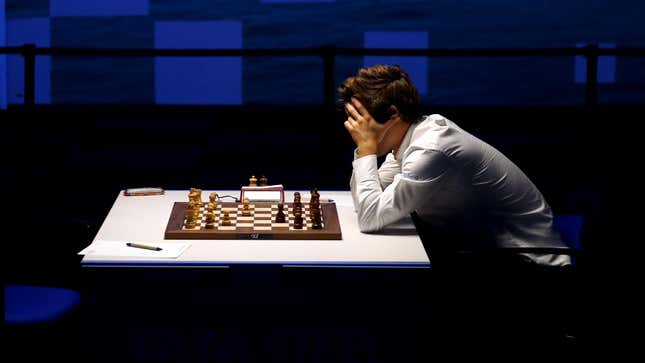 Magnus Carlsen holds his head in his hands at a chess match in Wijk.