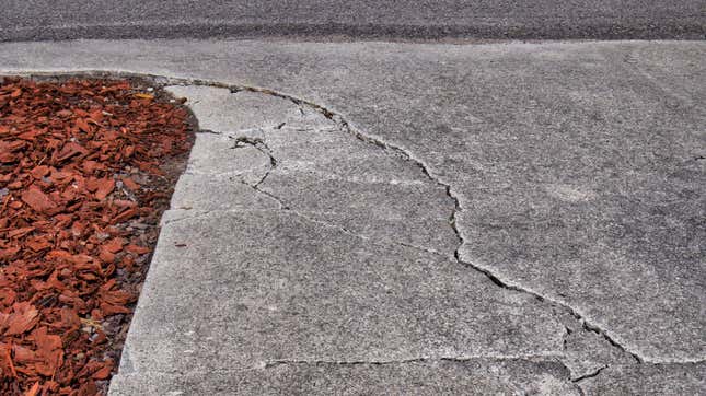 Image for article titled The Most Common Reasons Your Driveway Is Sinking (and How to Fix Them)