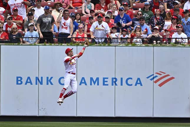 May 29, 2023; St. Louis, Missouri, USA; St. Louis Cardinals center fielder Lars Nootbaar (21) leaps at the wall and catches a fly ball hit by Kansas City Royals second baseman Michael Massey (not pictured) during the second inning at Busch Stadium.