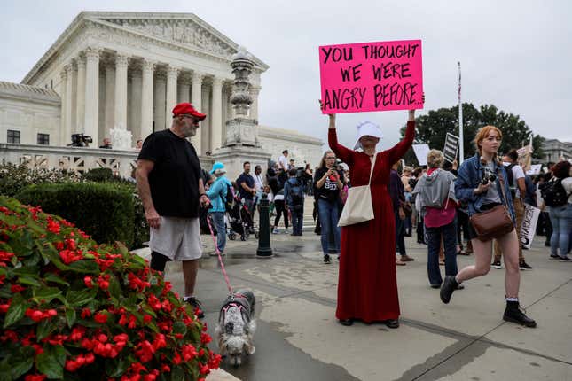 A protester demonstrates at the US Supreme Court on Brett Kavanaugh’s first day as a justice.