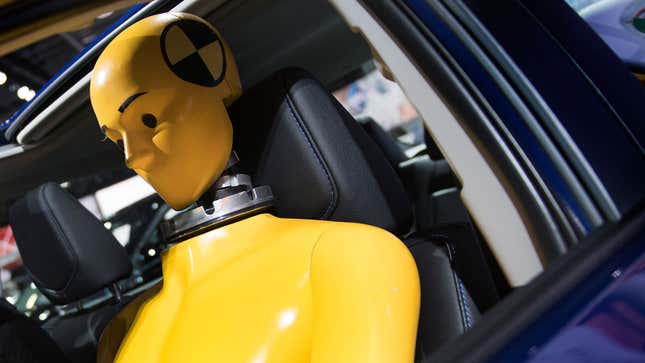 A photo of a yellow crash test dummy. 