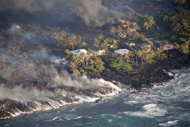 Image for article titled New aerial photos show Kilauea’s lava devouring neighborhoods