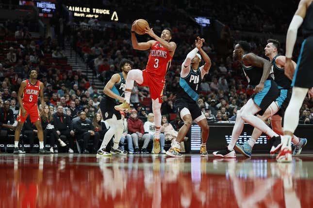 Mar 27, 2023; Portland, Oregon, USA; New Orleans Pelicans shooting guard CJ McCollum (3) drives to the basket past Portland Trail Blazers shooting guard Keon Johnson (6) during the first half at Moda Center.