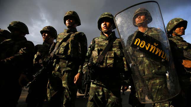 Thai soldiers stand guard during a coup at the Army Club where Thailand’s army chief held a meeting with all rival factions in central Bangkok.