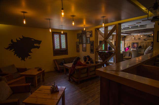 Young women deep in conversation at Winterfell café.
