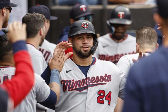 Oct 5, 2022; Chicago, Illinois, USA; Minnesota Twins catcher Gary Sanchez (24) celebrates with teammates after scoring against the Chicago White Sox during the second inning at Guaranteed Rate Field.