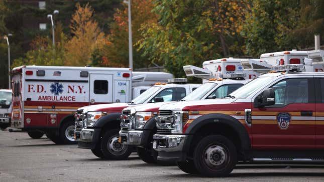 A photo of a fleet of Ford ambulances. 