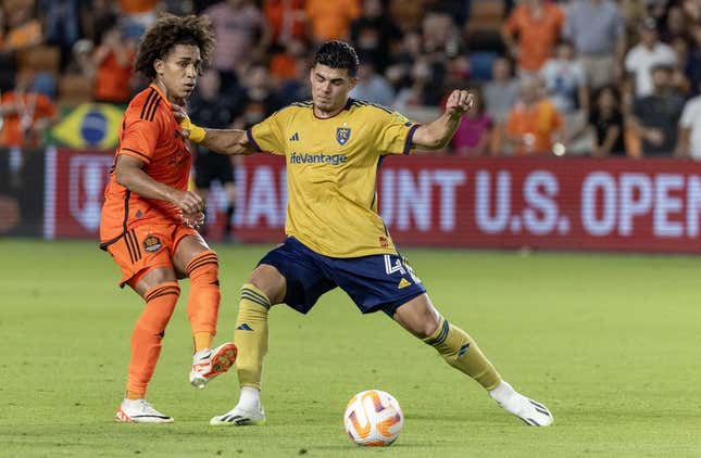 Aug 23, 2023; Houston, TX, USA; Houston Dynamo midfielder Adalberto Carrasquilla (20) passes against Real Salt Lake defender Brayan Vera (4) in the second half at Shell Energy Stadium.