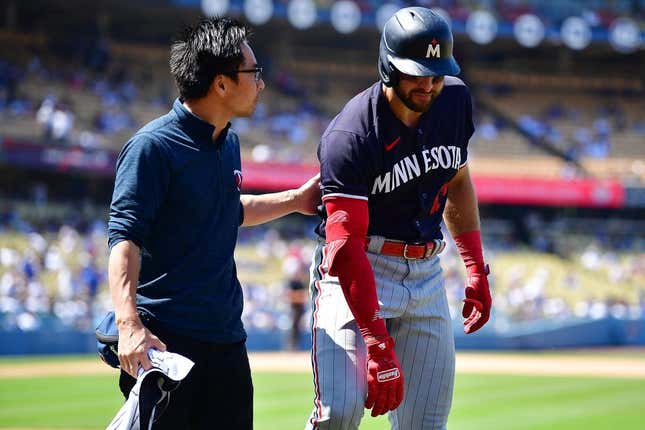 May 17, 2023; Los Angeles, California, USA; Minnesota Twins right fielder Joey Gallo (13) leaves after suffering an apparent injury during his at bat against the Los Angeles Dodgers during the ninth inning at Dodger Stadium.