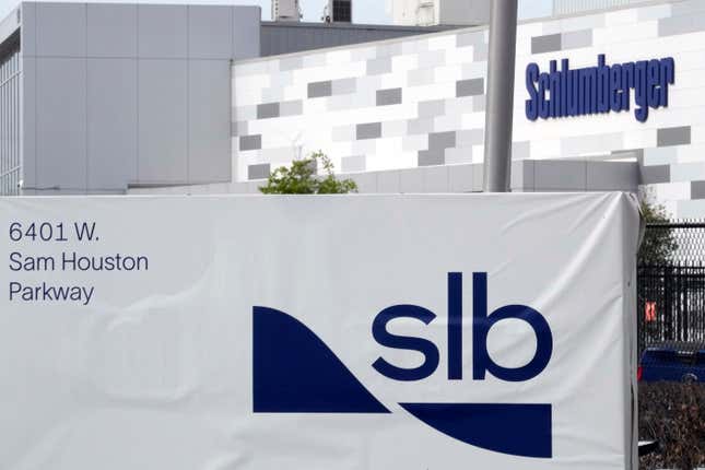 FILE - A sign for SLB, formerly Schlumberger, is displayed at the building on Tuesday, March 21, 2023, in Houston. Sen. Bob Menendez, the head of the U.S. Senate Foreign Relations Committee, asked the country’s top three oilfield services companies, including SLB, to explain why they continued doing business in Russia after its invasion of Ukraine, and demanded that they commit to “cease all investments” in Russia’s fossil fuel infrastructure. (AP Photo/David J. Phillip, File)