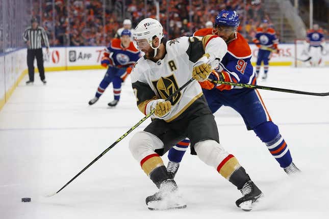 May 10, 2023; Edmonton, Alberta, CAN; Vegas Golden Knights defensemen Alex Pietrangelo (7) looks to move the puck in front of Edmonton Oilers forward Evander Kane (91) during the third period in game four of the second round of the 2023 Stanley Cup Playoffs at Rogers Place.