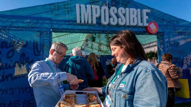 People smiling at Impossible Foods event