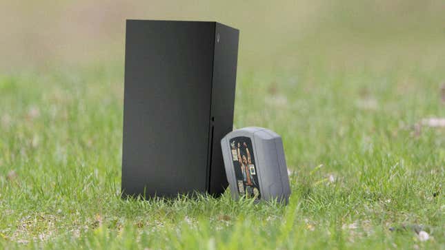 Image for article titled Unlikely Friendship: This Baby Xbox Is Best Friends With An N64 ‘WWF War Zone’ Cartridge