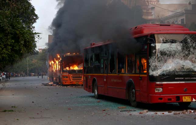 Passenger buses go up in flames during a protest against Citizenship Amendment Act in New Delhi.