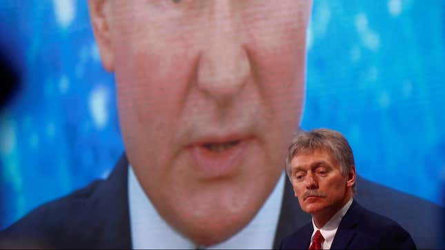 Kremlin spokesman Dmitry Peskov sits in front of an electronic screen during Russian President Vladimir Putin’s annual end-of-year news conference, December 2020. REUTERS/Maxim Shemetov