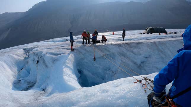 The JPL team lowering the robot’s sensor head into a vertical shaft in British Columbia in September 2022.