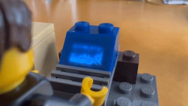 An image shows a blue Lego brick running Doom.