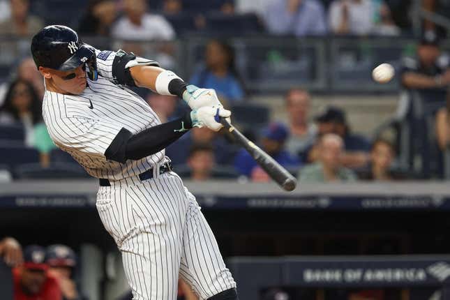 Aug 23, 2023; Bronx, New York, USA; New York Yankees right fielder Aaron Judge (99) hits a grand slam home run during the second inning against the Washington Nationals at Yankee Stadium.