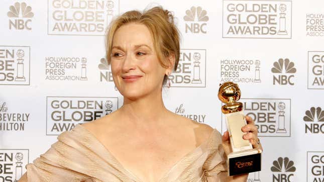 Meryl Streep holding the Golden Globe for her role in The Devil Wears Prada.