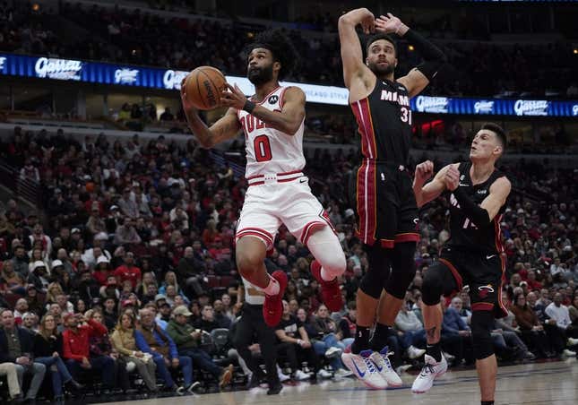 Mar 18, 2023; Chicago, Illinois, USA; Miami Heat guard Max Strus (31) defends Chicago Bulls guard Coby White (0) during the first half at United Center.