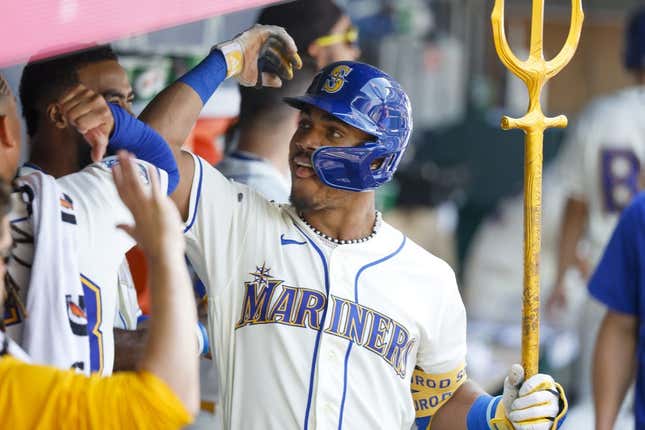 Aug 27, 2023; Seattle, Washington, USA; Seattle Mariners center fielder Julio Rodriguez (44) celebrates in the dugout after hitting a two-run home run against the Kansas City Royals during the fifth inning at T-Mobile Park.