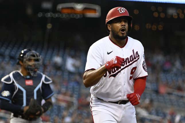 Apr 4, 2023; Washington, District of Columbia, USA; Washington Nationals third baseman Jeimer Candelario (9) reacts after scoring a run against the Tampa Bay Rays during the first inning at Nationals Park.