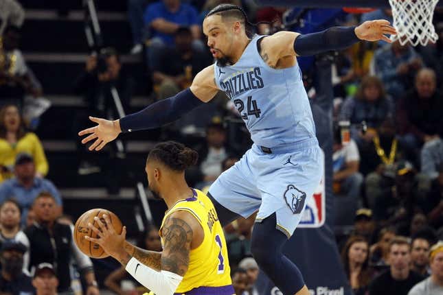 Apr 26, 2023; Memphis, Tennessee, USA; Memphis Grizzlies forward Dillon Brooks (24) defends Los Angeles Lakers guard D'Angelo Russell (1) during the second half during game five of the 2023 NBA playoffs at FedExForum.