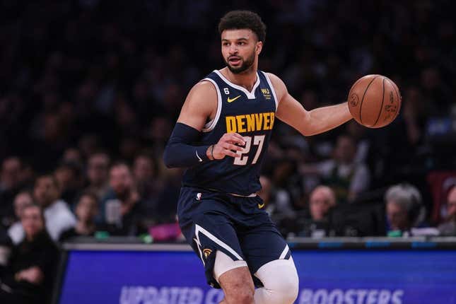 Mar 19, 2023; Brooklyn, New York, USA; Denver Nuggets guard Jamal Murray (27) dribbles during the first half against the Brooklyn Nets at Barclays Center.