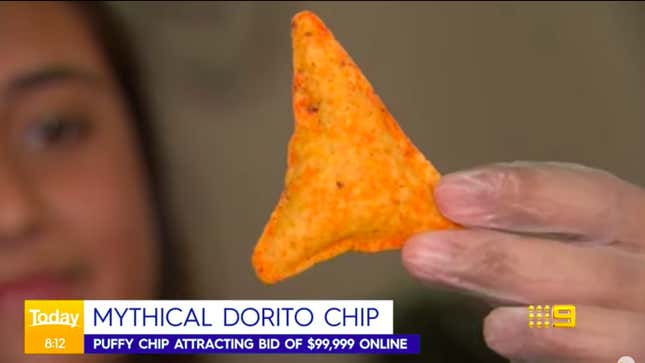 TV News screenshot of hand holding puffy Dorito