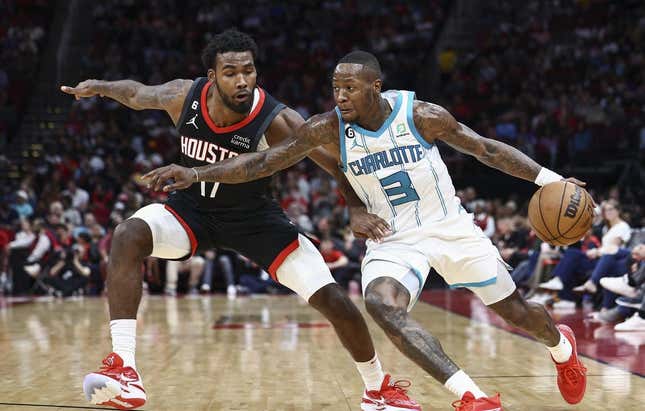 Jan 18, 2023; Houston, Texas, USA;  Charlotte Hornets guard Terry Rozier (3) controls the ball as Houston Rockets forward Tari Eason (17) defends during the third quarter at Toyota Center.