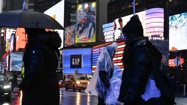 People walk in the rain in Times Square late last month. 