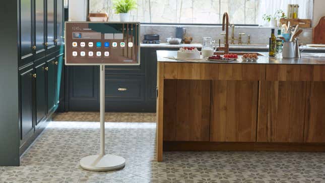 The original LG StanbyME with its tall display stand in a kitchen.