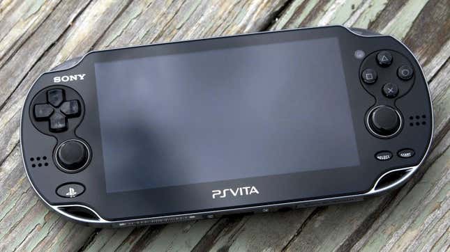 Sony's PSVita on a wood table with news that PlayStation is working on a streaming handheld.