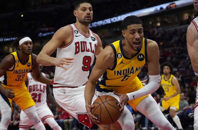 Mar 5, 2023; Chicago, Illinois, USA; Chicago Bulls center Nikola Vucevic (9) defends Indiana Pacers guard Tyrese Haliburton (0) during the first quarter at United Center.
