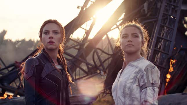 Natasha Romanoff and Yelena Belova, in their respective black and outfits, stand in front of metal wreckage.