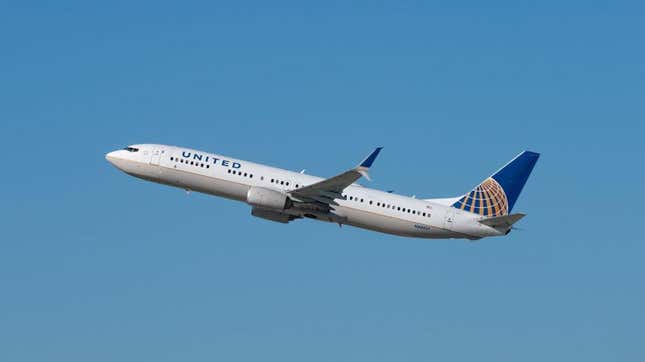 United Airlines plane takes off into clear blue sky