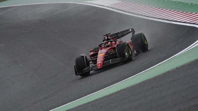 A photo of Charles Leclerc racing his Ferrari F1 car in Japan. 