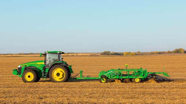 A profile photo of a John Deere tractor in a field.