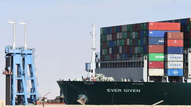 A picture taken on March 29, 2021 shows the Panama-flagged MV ‘Ever Given’ container ship after being fully dislodged from the banks of the Suez Canal, near Suez city. - The vessel, a megaship the length of four football fields, was refloated and the Suez Canal reopened to traffic in the afternoon, sparking relief almost a week after the huge container ship got stuck and blocked a major artery for global trade. 